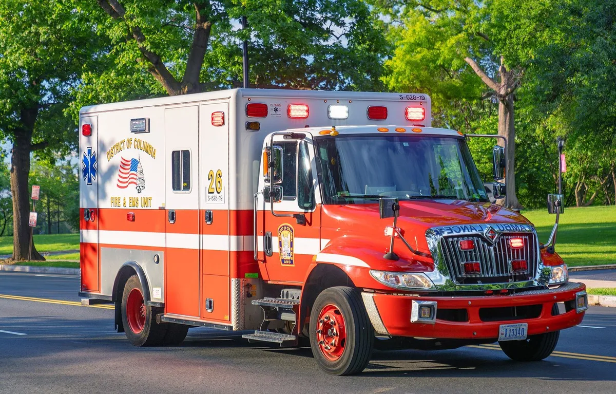 Ambulance unit responding on a city street