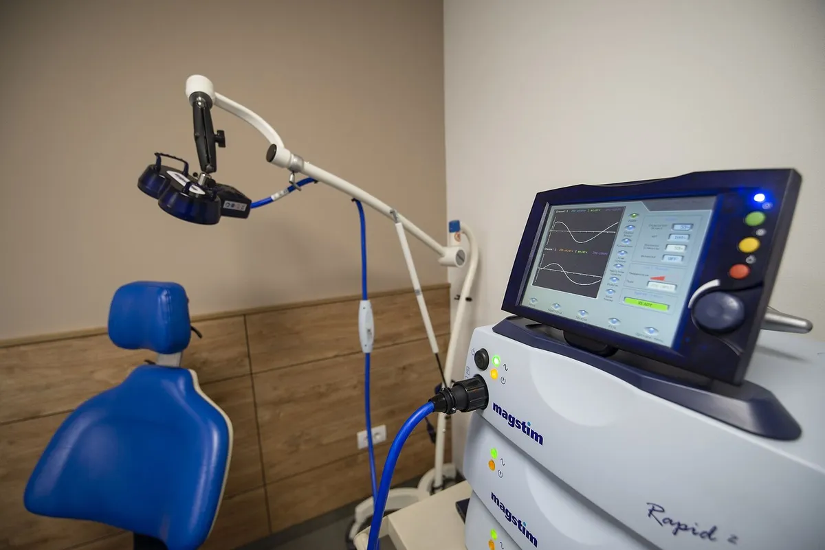 Clinical treatment room with a specialized medical device and patient chair